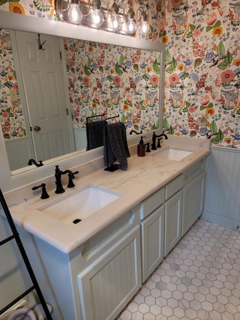 Bathroom remodel with new wallpaper, fixtures, and more